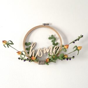 embroidery hoop home sign with orange flowers